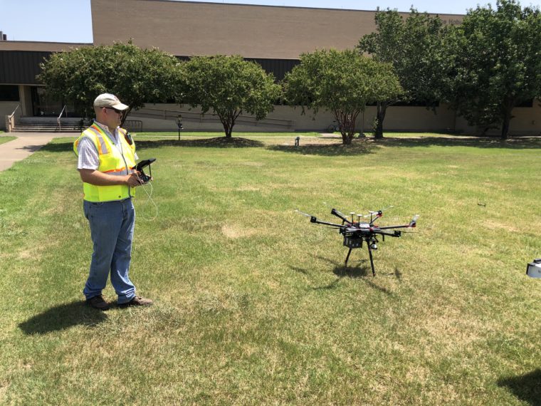Agricultural Engineer piloting a drone during a test of the UAV.